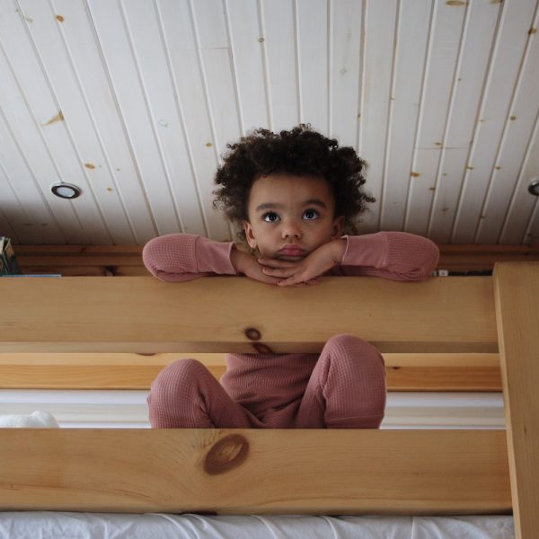 Child on Cabin Bunk Bed